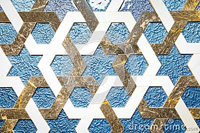 Ornament on the wall of marble tiles in the form of intersecting lines Stock Photo