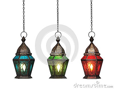 Ornamental Arabic lantern with burning candle glowing isolated on white background with clipping path Stock Photo