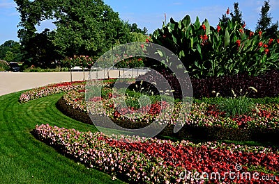 Ornamental flowerbed in front of the castle on the ground floor. The planting of annuals is in the shape of a circle with a moon s Stock Photo