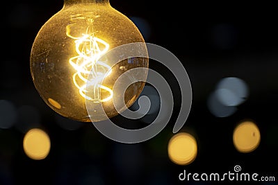ornamental incandescent lamp with helicoidal filament for a relaxed atmosphere. Stock Photo