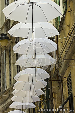 Ornamental white umbrellas in town Editorial Stock Photo