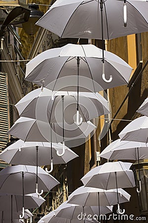 Ornamental white umbrellas in town Editorial Stock Photo