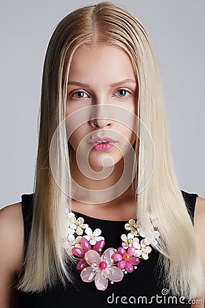 Ornamentation. Snazzy Blond Woman with Floral Necklace Stock Photo