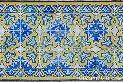 Ornate brightly colored Portugese tile texture in blue and yellow Stock Photo