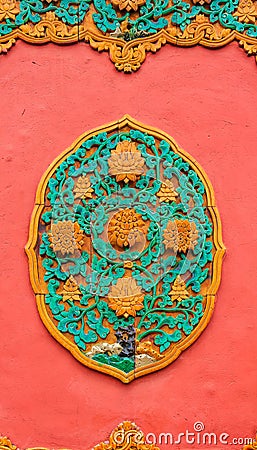 Ornate ceramic ornament on the wall in the Forbidden City of Beijing China Stock Photo