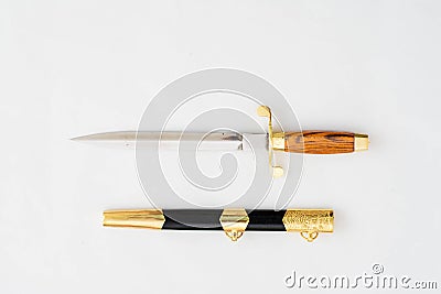 Ornate ceremonial dagger next to a jeweled scabbard Stock Photo