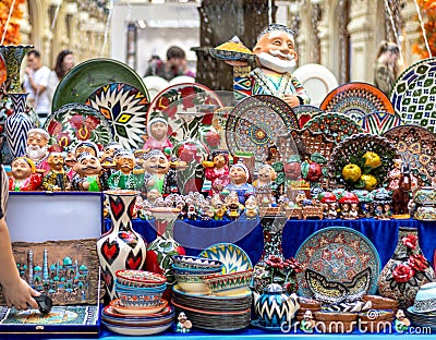 Ornate colorful oriental dishes and ceramics on market window. Silk Road Stock Photo