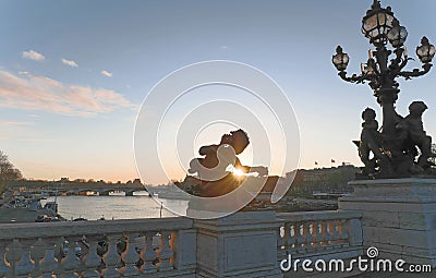 Ornate lamp posts along the Alexandre bridge III br in Paris Stock Photo