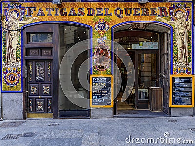 Ornate mosaic facade of the restaurant called Fatigas del Querer, meaning Labor of Love restaurant in Madrid, Spain Editorial Stock Photo