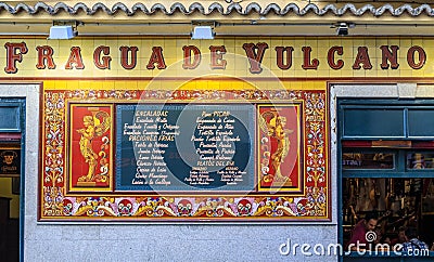 Ornate mosaic facade of the restaurant called Fatigas del Querer, meaning Labor of Love restaurant in Madrid, Spain Editorial Stock Photo