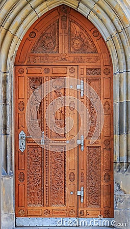 Ornate old carved wooden door in the Prague Castle complex Stock Photo