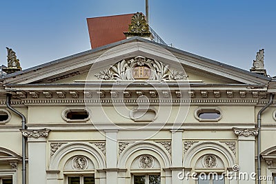 Ornate pediment above the entrance of an historic building in Klaipeda, Lithuania Stock Photo