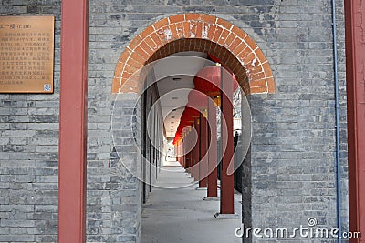 Ornate stone archway decorated by red lanterns in Beijing, China Editorial Stock Photo