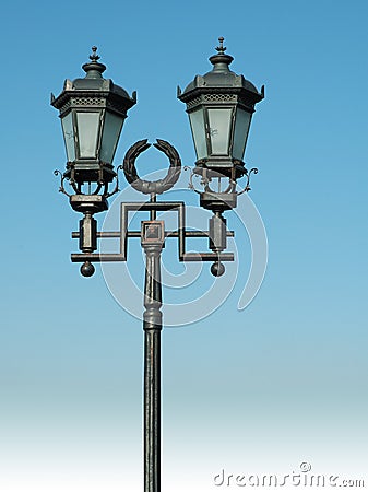 Ornate street lamp on blue sky Stock Photo