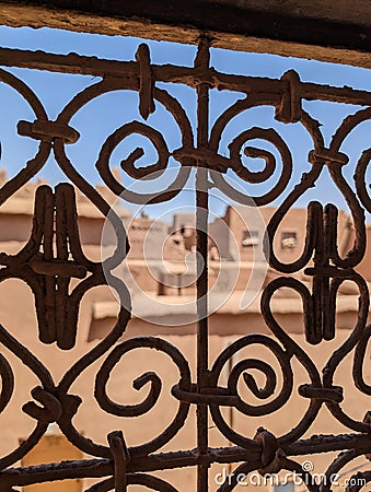 Ornate traditional window grid of a berber house ruin in the city center of Amezrou Stock Photo