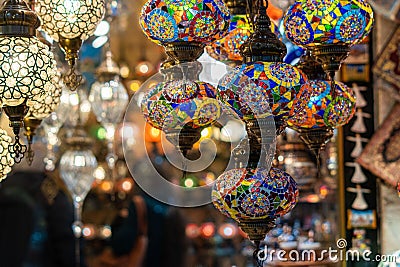 Ornate and vibrant collection of Turkish lamps hanging in front of a market Stock Photo