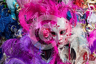 Carnival mask with colorful feathers. Editorial Stock Photo