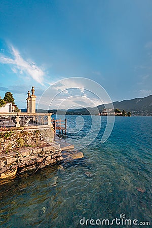 View of a building on Lake Orta with the Island of San Giulio in the background Editorial Stock Photo