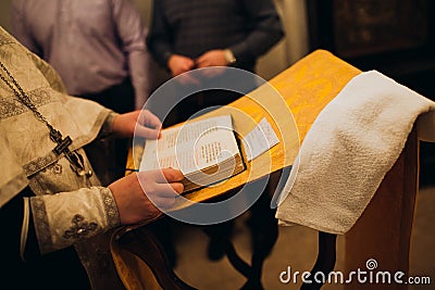 Orthodox Christian Priest and Holy Bible in the church. Epiphany ceremony rite. Stock Photo