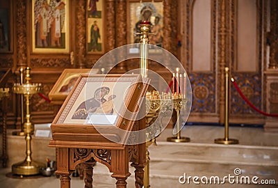 Orthodox Church, icon of the mother of God with a child, candles, altar Stock Photo