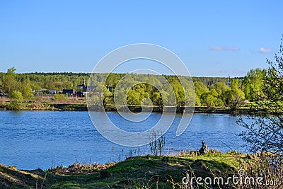 The Orthodox Church in the Russian village, standing on the river bank. The Russian Plain Stock Photo