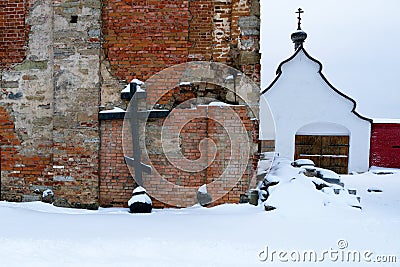 Orthodox cross, shot from the dome of the dilapidated chapel in the men`s monastery, Russia, winter. Stock Photo