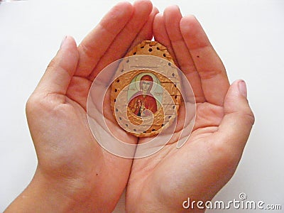Orthodox icon in children hands close up Stock Photo