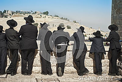 Orthodox students of Yeshivah stand in front of the Western Wall. JERUSALEM, OLD CITY. JULY 14, 2010. Editorial Stock Photo