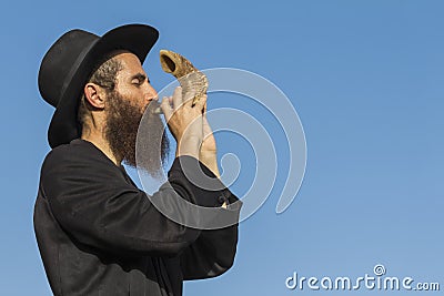 Orthodox Jewish man with a Shofar at Rosh Hashana Stock Photo