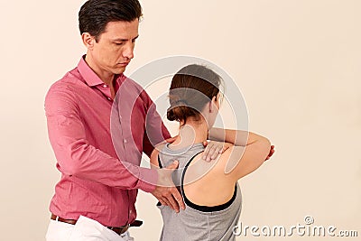 Orthopedic surgeon with a patient in treatment Stock Photo