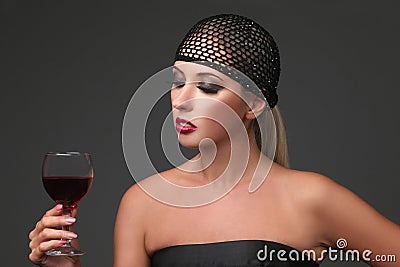 Ortrait of beautiful young woman with wine glass. Girl in retro style. Stock Photo