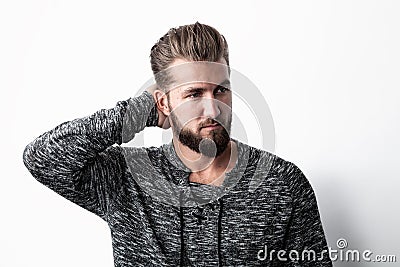 Ortrait of a man, thinking about something, scratching a his head Stock Photo