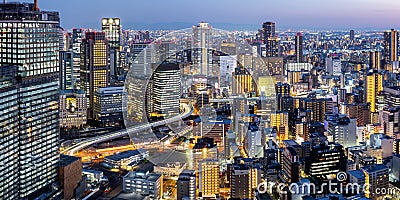 Osaka big city lights from above skyline with skyscraper panorama at twilight in Japan Editorial Stock Photo