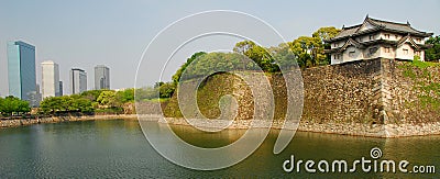 Osaka castle moat and skyscrapers Stock Photo