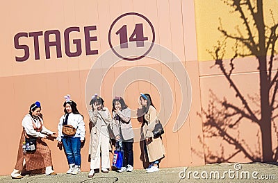 Osaka, Japan on April 9, 2019. Five Asian best friends are taking pictures in front of the Stage 14 studio facade at Universal Editorial Stock Photo