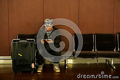 Chinese tourist are reading books to waiting time for back home country Editorial Stock Photo