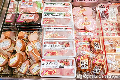 Closeup hams and processed meat in packs for sale in Japan supermarket`s freezer Editorial Stock Photo