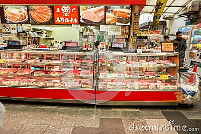 Raw sliced beef and pork display in freezer for sale with the Japanese names and label price Editorial Stock Photo