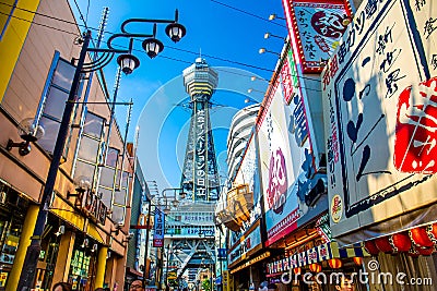 OSAKA, JAPAN - JUNE 20, 2019 :: Tsutenkaku tower located in the Shinsekai, well-known landmark of Osaka. Famous shopping streets i Editorial Stock Photo
