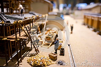 Closeup miniature models and toys of Japanese worker building a house Stock Photo