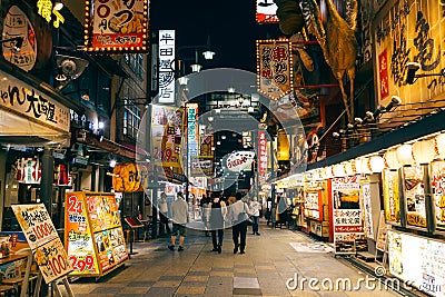 Night view of Shinsekai district food restaurant street in Osaka, Japan Editorial Stock Photo