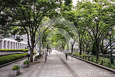 Passers by in Osaka streets and parks during a hot summer day, Central Osaka, Nakanoshima Island, Japan, Editorial Stock Photo