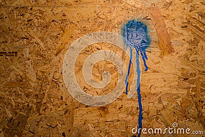 OSB wood plate with a paint splat Stock Photo