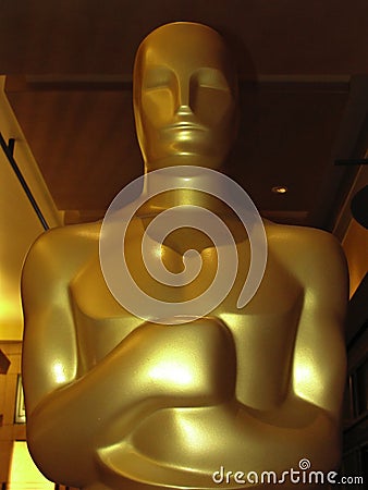 Oscar statue in close up and partial silhouette Editorial Stock Photo