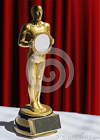 Gold statuette award red curtain Editorial Stock Photo