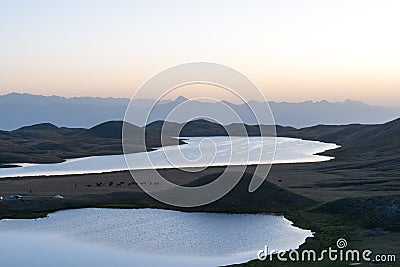 Morning Sunlight Landscape of Tulpar Kol Lake in Alay Valley, Osh, Kyrgyzstan. Stock Photo