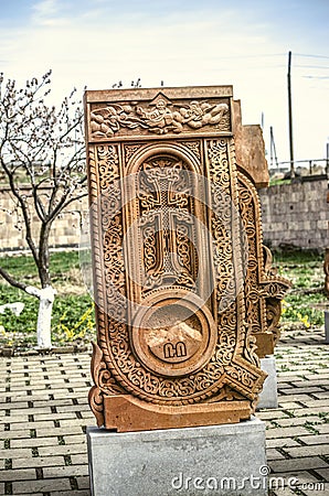 Stone cross carved with ornaments in the form of the first letter of the Armenian alphabet, created by Mesrop Mashtots in the vill Editorial Stock Photo