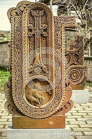 Stone cross carved with ornaments in the form of the twentieth letter of the Armenian alphabet,created by Mesrop Mashtots in the Editorial Stock Photo