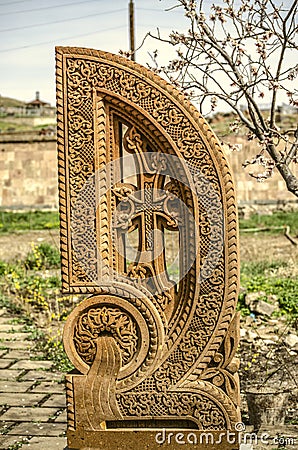 Stone cross carved with ornaments in the form of the twenty-seventh letter of the Armenian alphabet, created by Mesrop Mashtots Editorial Stock Photo