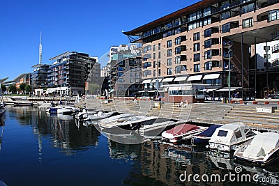 Oslo harbour with boats and yachts and on background some modern Editorial Stock Photo